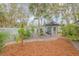 Backyard with shed, landscaping, and walkway at 2304 Date Palm Dr, Edgewater, FL 32141