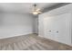 Well-lit bedroom with double-door closet and ceiling fan at 2304 Date Palm Dr, Edgewater, FL 32141