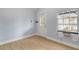 Bright bedroom with light walls, wood floors and a window at 2304 Date Palm Dr, Edgewater, FL 32141