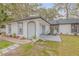 Newly remodeled home with a spacious yard and walkway at 2304 Date Palm Dr, Edgewater, FL 32141