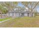 Charming single story home with mature trees and walkway at 2304 Date Palm Dr, Edgewater, FL 32141