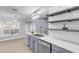 Modern kitchen with gray cabinets and white subway tile backsplash at 2304 Date Palm Dr, Edgewater, FL 32141