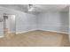 Spacious living room with light gray walls and wood floors at 2304 Date Palm Dr, Edgewater, FL 32141