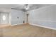 Bright living room with light gray walls and wood-look floors at 2304 Date Palm Dr, Edgewater, FL 32141