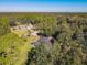 Aerial view of house and expansive green space at 2322 Melonie Trl, New Smyrna Beach, FL 32168