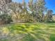 Spacious backyard with lush grass and wooden fence at 2322 Melonie Trl, New Smyrna Beach, FL 32168