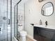 Modern bathroom with subway tile shower and floating vanity at 2322 Melonie Trl, New Smyrna Beach, FL 32168