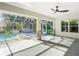 Screened pool area with hot tub and ceiling fan at 2322 Melonie Trl, New Smyrna Beach, FL 32168