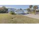 White two-story house with attached garage and grassy yard at 239 Kirkland Rd, New Smyrna Beach, FL 32169