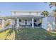 Covered patio with seating area and outdoor table at 239 Kirkland Rd, New Smyrna Beach, FL 32169