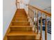 Elegant wooden staircase with detailed railing at 239 Kirkland Rd, New Smyrna Beach, FL 32169