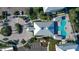 Aerial view of community pool, parking, and building at 3 Riverwalk Dr # 302, New Smyrna Beach, FL 32169