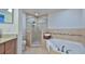 Bathroom with walk-in shower and soaking tub at 3 Riverwalk Dr # 302, New Smyrna Beach, FL 32169