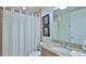 Bathroom with shower/tub combo and granite vanity at 3 Riverwalk Dr # 302, New Smyrna Beach, FL 32169