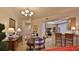 Kitchen and dining area with granite counters at 3 Riverwalk Dr # 302, New Smyrna Beach, FL 32169