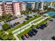 Aerial view of community amenities including tennis courts, shuffleboard, and parking at 3 Riverwalk Dr # 401, New Smyrna Beach, FL 32169