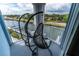 Relaxing balcony with wicker chairs and waterfront views at 3 Riverwalk Dr # 401, New Smyrna Beach, FL 32169