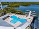 Relaxing community pool with lounge chairs and hot tub at 3 Riverwalk Dr # 401, New Smyrna Beach, FL 32169