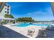 Resort-style pool with lounge chairs and waterfront views at 3 Riverwalk Dr # 401, New Smyrna Beach, FL 32169