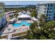 Community pool and hot tub with waterfront views at 3 Riverwalk Dr # 401, New Smyrna Beach, FL 32169