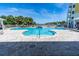 Relaxing kidney-shaped pool with surrounding patio at 3 Riverwalk Dr # 401, New Smyrna Beach, FL 32169