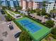 Community tennis court with green and blue surface at 3 Riverwalk Dr # 401, New Smyrna Beach, FL 32169