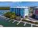 Waterfront condo building with private boat slips and lush landscaping at 3 Riverwalk Dr # 401, New Smyrna Beach, FL 32169