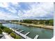 Panoramic view of canal, boats, and waterfront homes at 3 Riverwalk Dr # 401, New Smyrna Beach, FL 32169