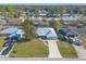 Bird's-eye view of a residential area showcasing a light teal house at 3015 Queen Palm Dr, Edgewater, FL 32141