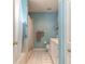 Bathroom with shower/tub combo, white vanity, and light blue walls at 3015 Queen Palm Dr, Edgewater, FL 32141