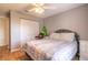 Bedroom with queen bed, gray walls, and double door closet at 3015 Queen Palm Dr, Edgewater, FL 32141