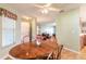 Bright dining room with a round wooden table and four chairs at 3015 Queen Palm Dr, Edgewater, FL 32141