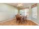 Cozy dining area with wooden table and chairs, near the kitchen at 3015 Queen Palm Dr, Edgewater, FL 32141