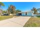 Cute light blue home with a metal roof and spacious driveway at 3015 Queen Palm Dr, Edgewater, FL 32141