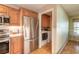 Convenient laundry room with washer and dryer located near the kitchen at 3015 Queen Palm Dr, Edgewater, FL 32141