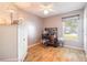 Home office with wood floors, desk, and built-in shelving at 3015 Queen Palm Dr, Edgewater, FL 32141