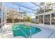 Refreshing screened-in pool with a fun watermelon floatie at 3015 Queen Palm Dr, Edgewater, FL 32141