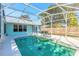 Inviting screened pool with a spacious deck at 3015 Queen Palm Dr, Edgewater, FL 32141