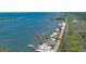 Bird's-eye view of the property and surrounding waterfront community at 303 River Rd, Oak Hill, FL 32759