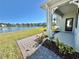 Charming backyard with pond view and brick pavers at 3035 Meleto Blvd, New Smyrna Beach, FL 32168