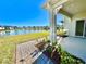 Covered patio with a picturesque view of the lake and community at 3035 Meleto Blvd, New Smyrna Beach, FL 32168