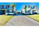 Shared paved driveway leading to two-story townhouses at 3035 Meleto Blvd, New Smyrna Beach, FL 32168