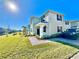 Two-story house with gray siding, burgundy shutters, and a paved walkway at 3035 Meleto Blvd, New Smyrna Beach, FL 32168