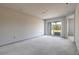 Unfinished bedroom with sliding glass doors leading outside at 3046 Isles Way, New Smyrna Beach, FL 32168