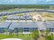 Aerial view of a luxury community with golf course at 3066 Isles Way, New Smyrna Beach, FL 32168