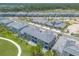 Aerial view of townhomes with a view of the golf course and surrounding area at 3066 Isles Way, New Smyrna Beach, FL 32168