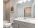 Clean bathroom with a gray vanity and a bathtub at 3066 Isles Way, New Smyrna Beach, FL 32168