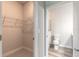 Bathroom with toilet, walk-in closet, and shower at 3066 Isles Way, New Smyrna Beach, FL 32168