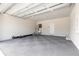 Spacious garage with gray flooring and extra storage at 3066 Isles Way, New Smyrna Beach, FL 32168