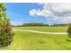 Landscaped green golf course with walking path at 3066 Isles Way, New Smyrna Beach, FL 32168